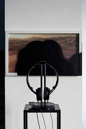 Marco Strappato. Over Painted ESO#4, 2015. C-type, spray paint, 31x52cm and Mondi Lontanissimi by Franco Battiato (1985). Headphones, headphone stand, iPod shuffle, lacobel, iron. Courtesy The Gallery Apart, Rome. Photo by Giorgio Benni